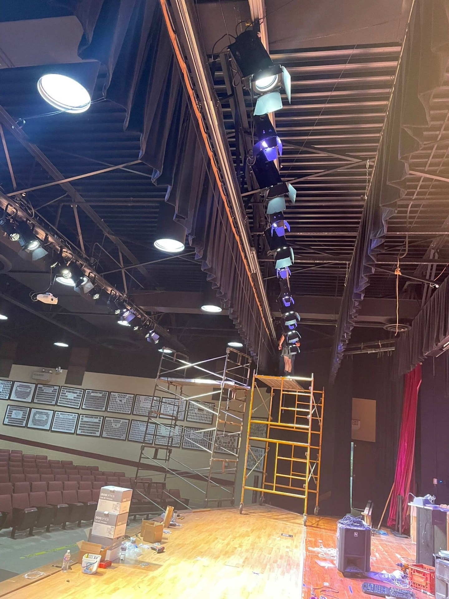 Lighting fixtures and access towers during a Chickasaw County auditorium installation